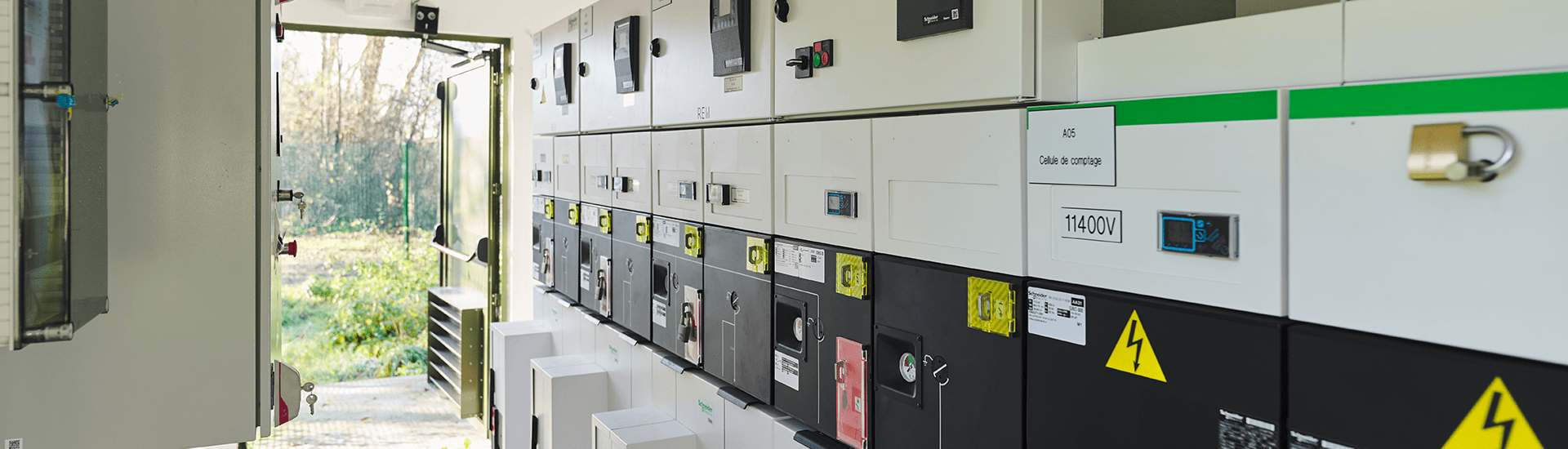 A room densely populated with various electrical boxes and wires, illustrating an intricate electrical system.